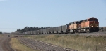 BNSF 5679 and 9874 With Loaded Train Wait to Leave the Orin Subdivision